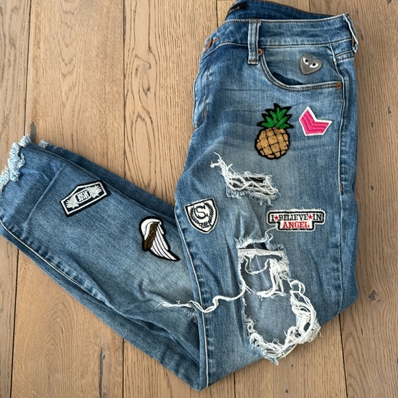 The cutest assorted patched jeans. Jeans have designer made holes for style. - Picture 5 of 5